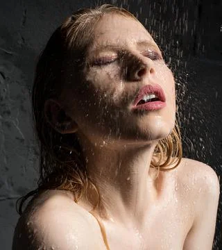 Girl's face on which drops of water fall portrat Stock Photos