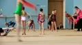 Girls gymnasts having training in gym before examination in Deriugina school HD Footage