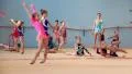 Girls gymnasts having training in gym before examination in Deriugina school HD Footage