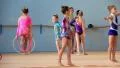Girls gymnasts having training in gym before examination in Deriugina school HD Footage