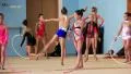 Girls gymnasts having training in gym before examination in Deriugina school HD Footage