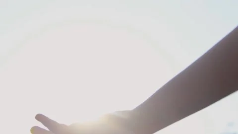 Girl's hand on the background of the sun. Stock Footage 142090189