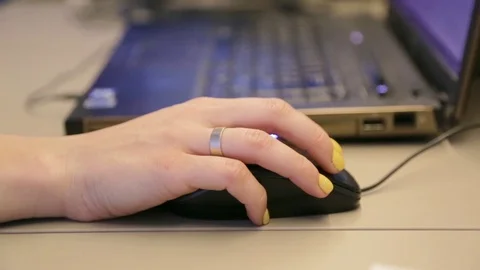 Girl's hand clicks on the mouse Stock Footage 127499604