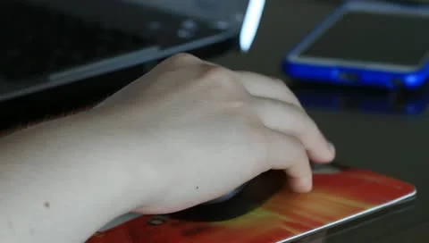 Girl's hand on computer mouse Video stock 11314726