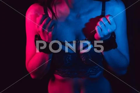 Girl's hands handcuffed for BDSM sex with submission Stock Photos