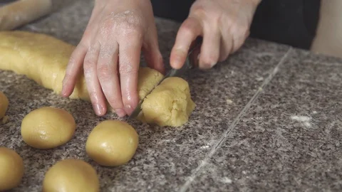 Girl's hands make the dough at home. Dessert of white dough. Stock Footage