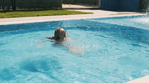 Girls having fun at the poolside Stock Footage 302805701