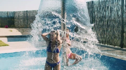 Girls having fun at the poolside Stock Footage 302806407