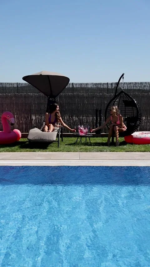 Girls having fun at the poolside Stock Footage 302808491