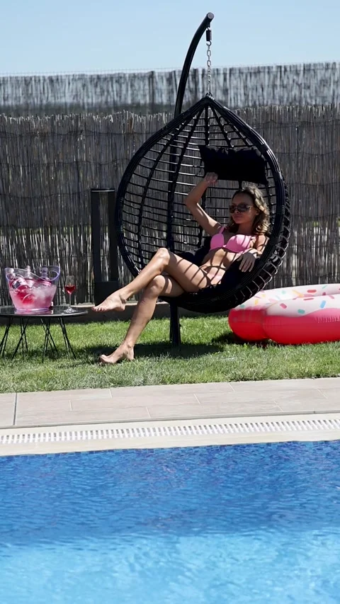 Girls having fun at the poolside Stock Footage 302808556