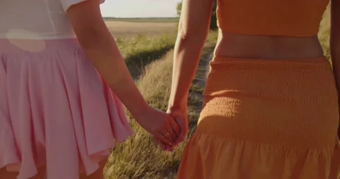 The girls held hands while walking in nature Stock Footage 204145235
