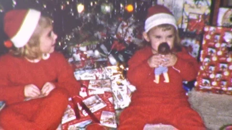 GIRLS KIDS Santa Suits Christmas Morning Day 1950s Vintage Film Home Movie Stock Footage