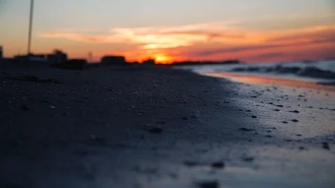 Girl's legs walking on the beach at sunset Stock Footage