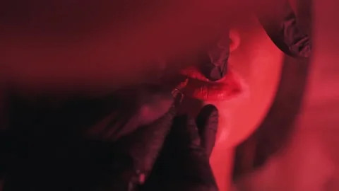 Girl's lips correction Stock Footage 130864699