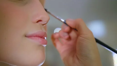 Girl's lips during makeup application, Delicate face Stock-Footage 136507792