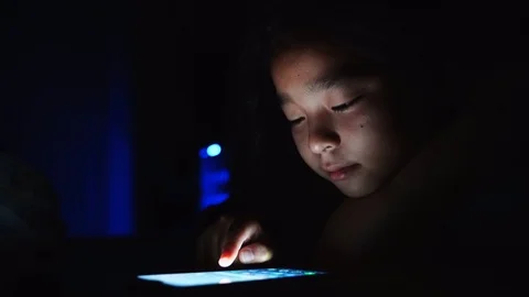 Girls lying on bed using smartphone texting on social media browsing online  動画素材 127542533