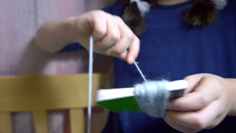 Girls making dolls from strings. Stock Footage 120558101