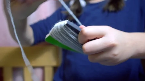 Girls making dolls from strings. Stock Footage 120558474