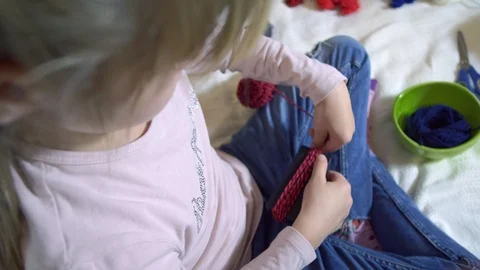 Girls making dolls from strings. Stock Footage 120558966