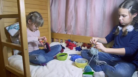 Girls making dolls from strings. Stock Footage 120559070