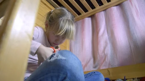 Girls making dolls from strings. Stock Footage 120559488
