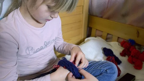 Girls making dolls from strings. Stock Footage 120560302