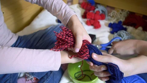 Girls making dolls from strings. Stock Footage 120560796