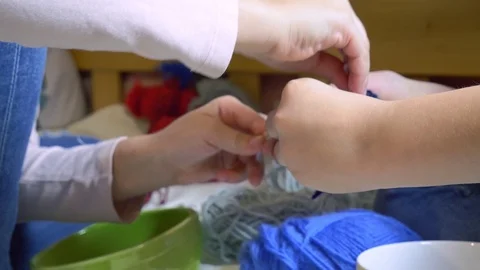 Girls making dolls from strings. Stock Footage 120562827