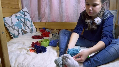 Girls making dolls from strings. Stock Footage 120563837