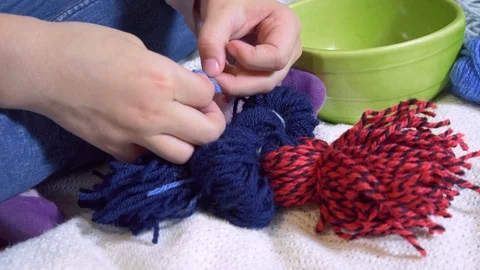 Girls making dolls from strings. Stock Footage 120564801