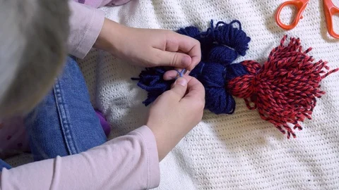 Girls making dolls from strings. Stock Footage 120565139