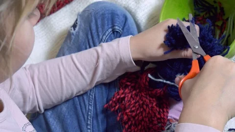Girls making dolls from strings. Stock Footage 120566649