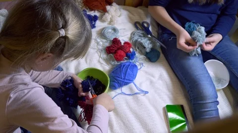 Girls making dolls from strings. Stock Footage 120567094
