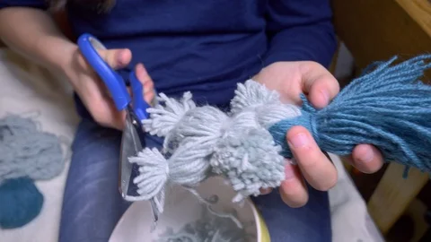 Girls making dolls from strings. Stock Footage 120567549