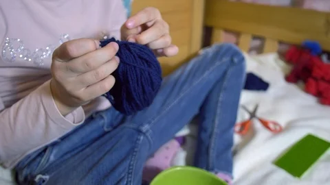 Girls making dolls from strings. Stock Footage 120732437