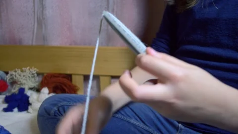 Girls making dolls from strings. Stock Footage 120733070