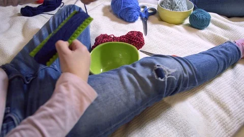 Girls making dolls from strings. Stock Footage 120734914