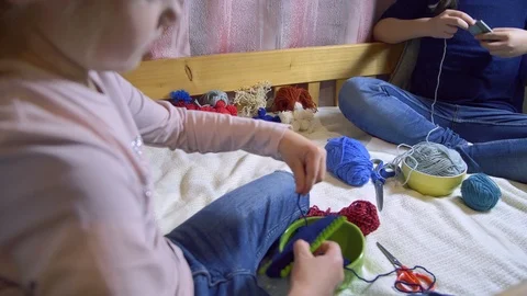 Girls making dolls from strings. Stock Footage 120734974