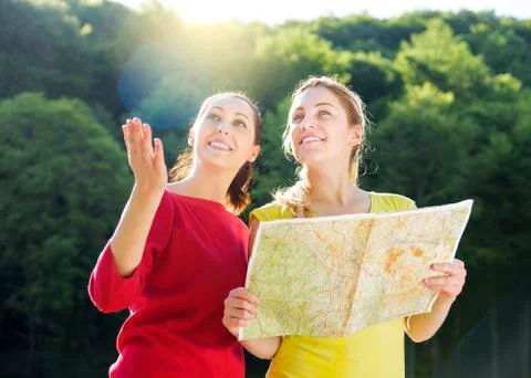 Girls with map Stock Photos
