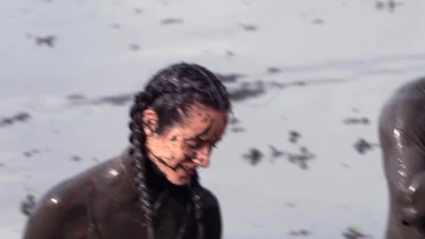 Girls in the mud pit with Side by side car sinking Stock Footage 302306194