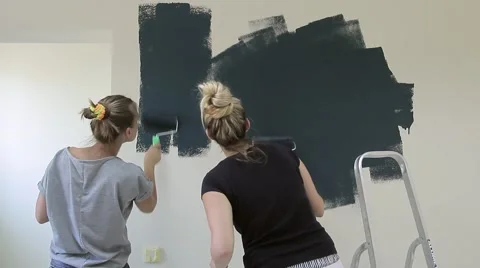 Girls paint wall with the rollers Stock Footage 67315674