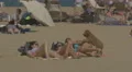 Girls playing with their dog on the beach in Barcelona 4k or 4k+ Resolution