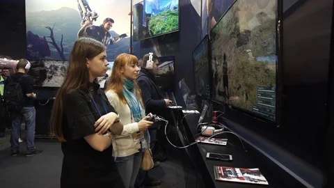 Girls playing video games using joystick Stock Footage 72287368