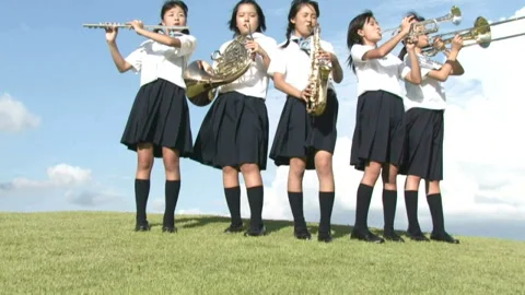 Girls Playing Wind Instruments on the Hill Video stock 332755706
