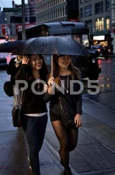 Girls in the Rain in NYC Stock Photos