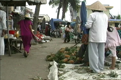 Girls run in Hoi An market Stock Footage
