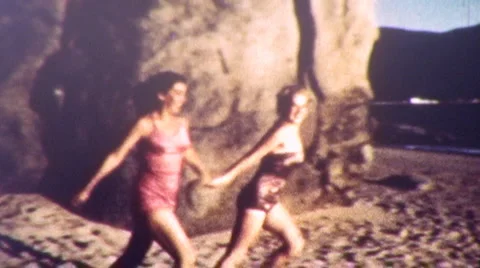GIRLS RUN INTO THE SEA Ocean Beach 1950s Vintage Amateur Film 8mm Home Movie Stock Footage