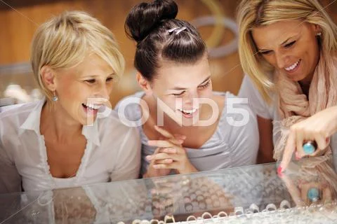Girls shopping in jewelry store Stock Photos