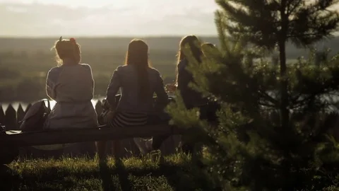 Girls sit on a bench Stock Footage 82346591