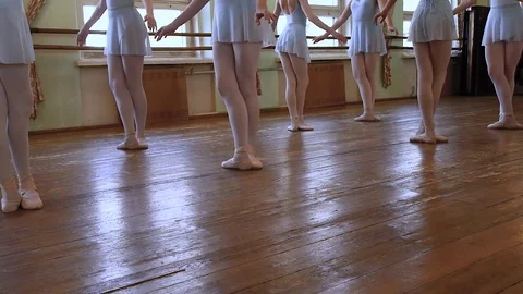 Girls stand in third position then begin to move different sides Stock Footage 75101601